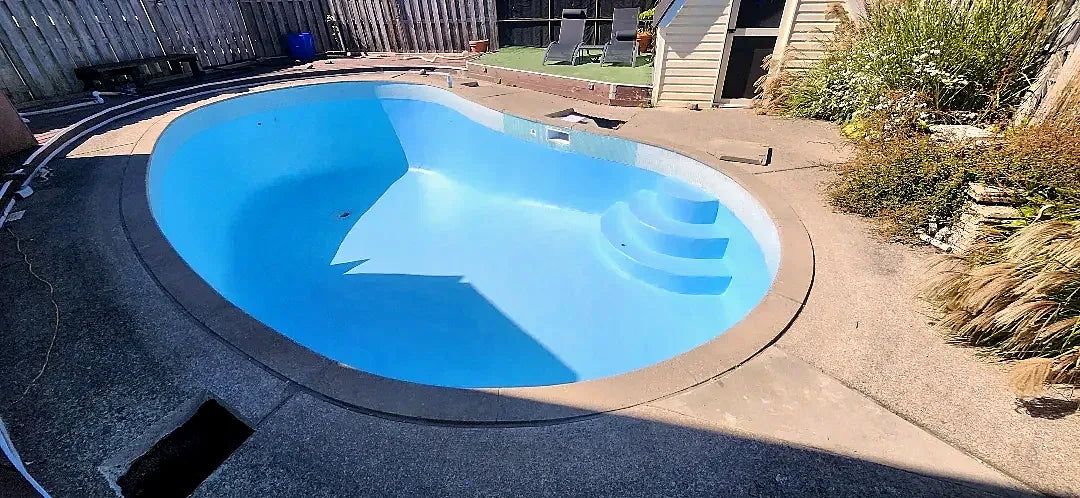 After: the kidney pool coated in light blue two-part epoxy