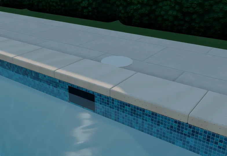 Natural stone pool coping meeting the deck
